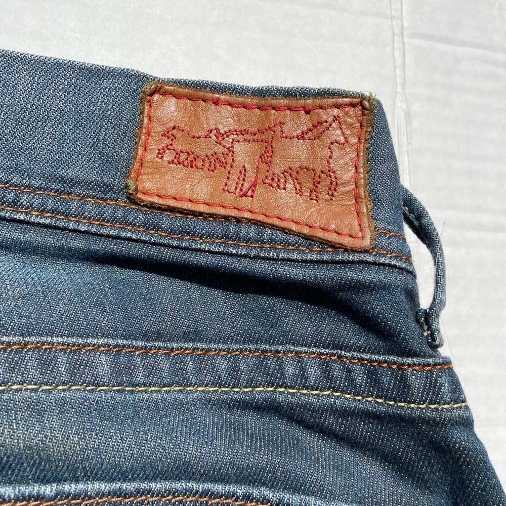 Levi Jeans with Yellow Stitched Bottoms with Stitched Horses on the back